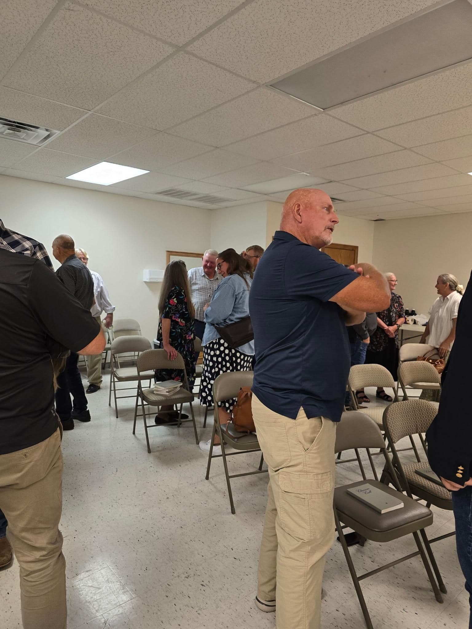 Members visiting together after worship